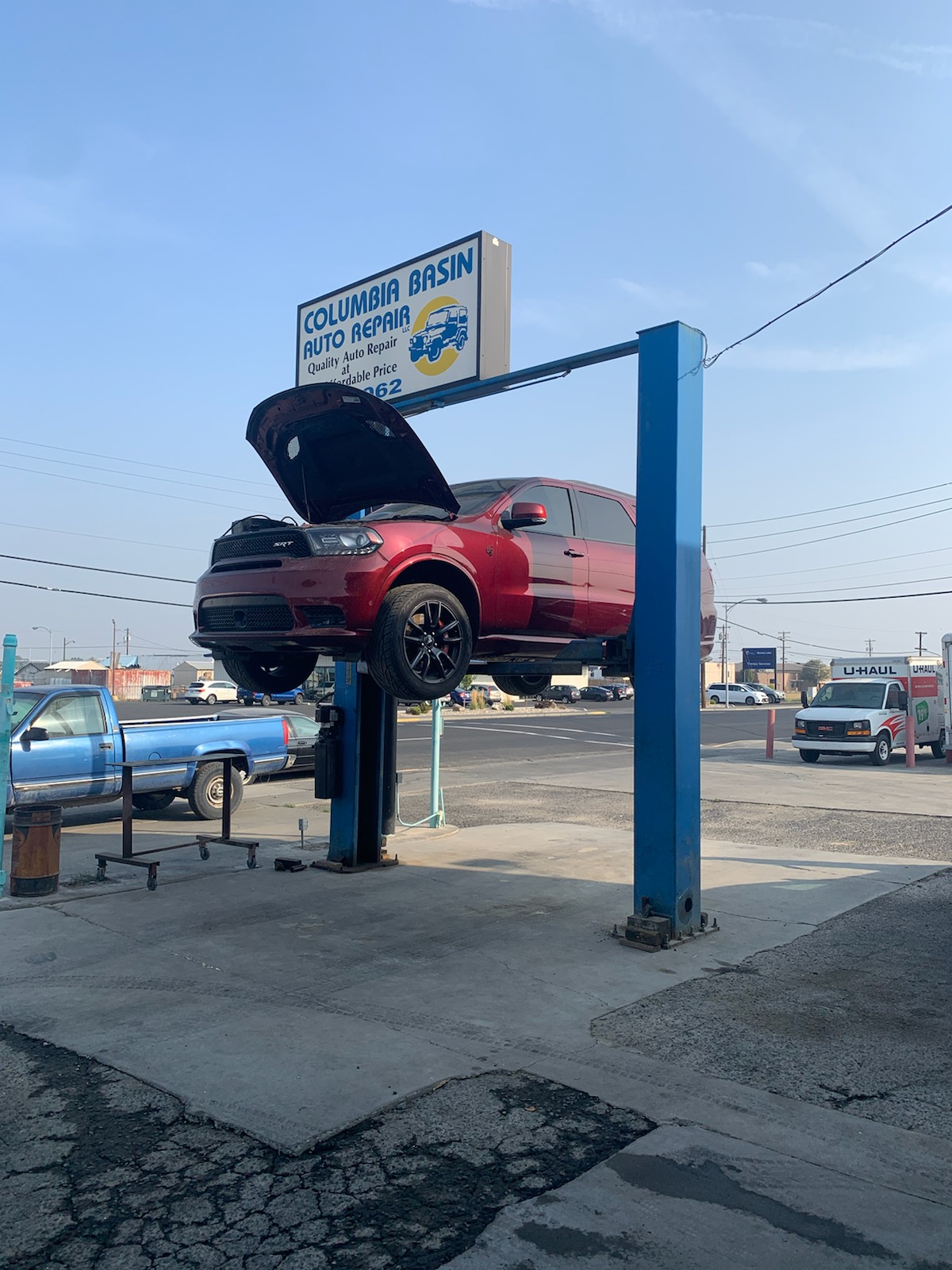 Columbia Basin Auto Repair — shop exterior with car on lift